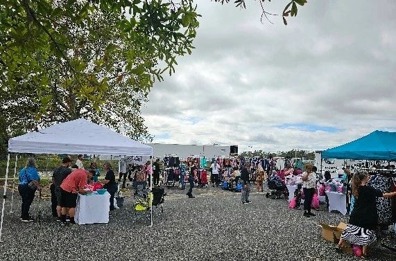 Outdoor market festival with crowds shopping