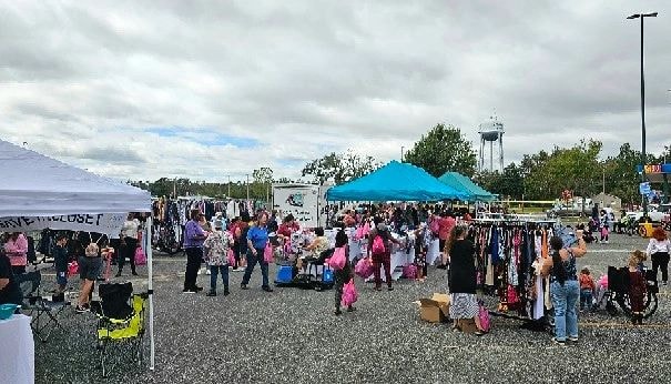 Outdoor community event with pink theme