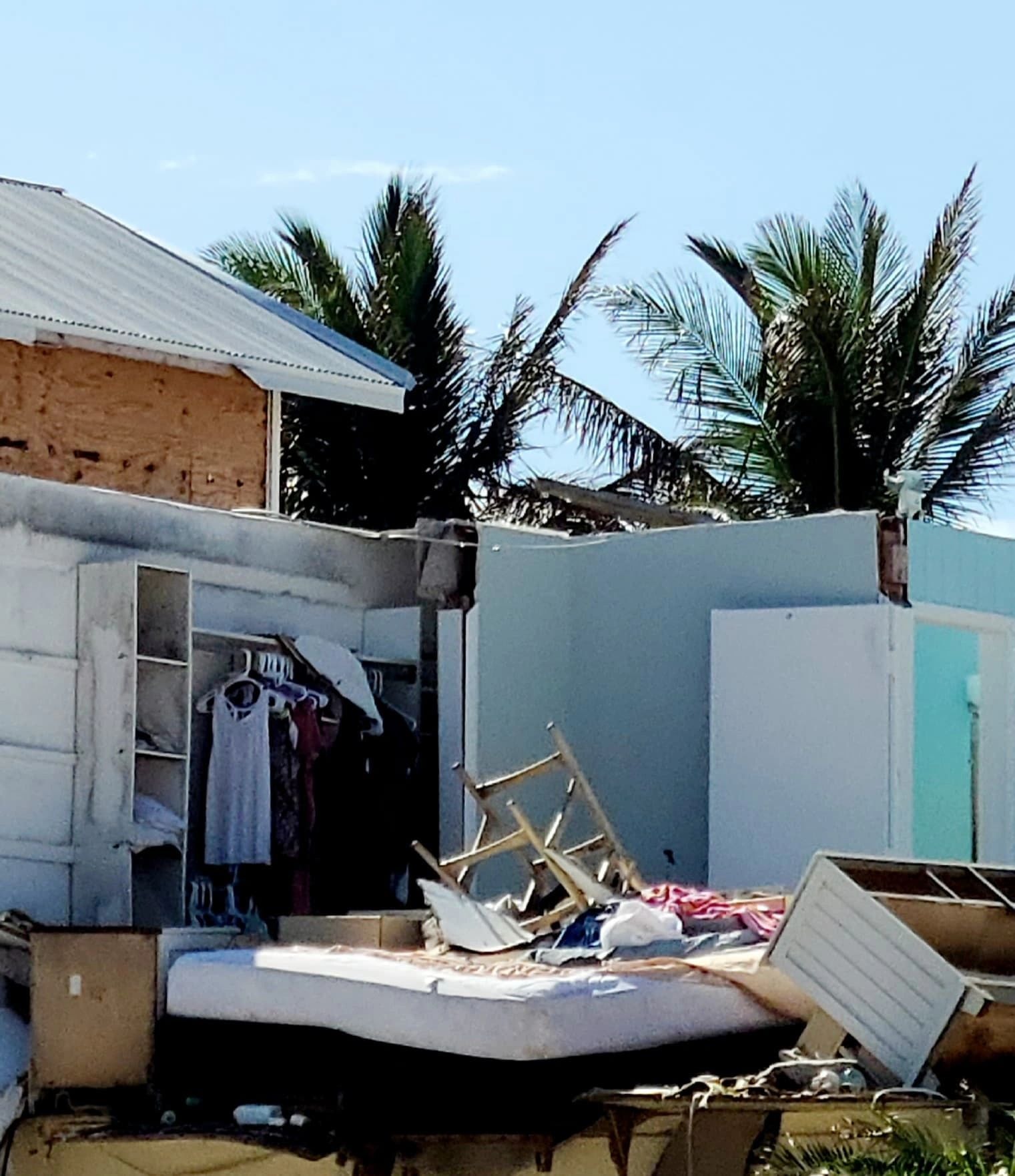 A home surrounded by debris in the aftermath of Hurricane Michael — the kind of community Save The Closet serves