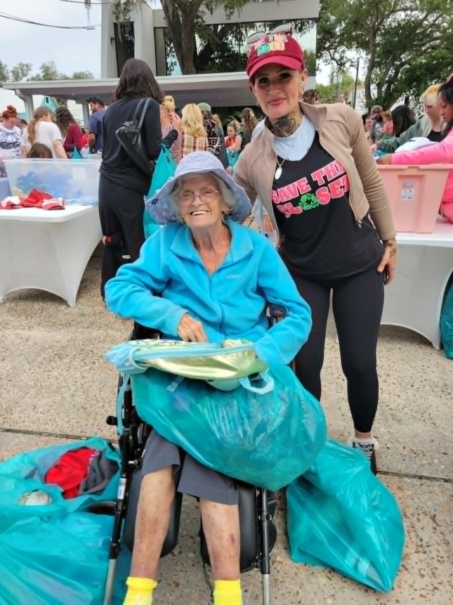 Community members sorting clothes at outdoor event