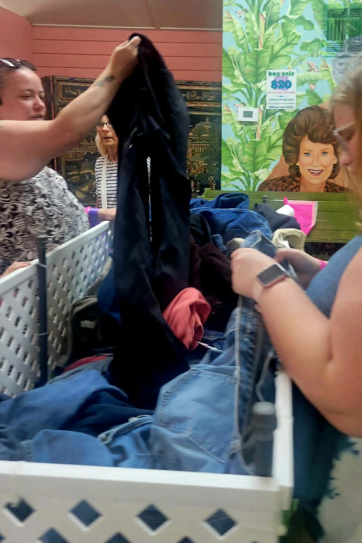 Customers browsing the $20 bag sale bins