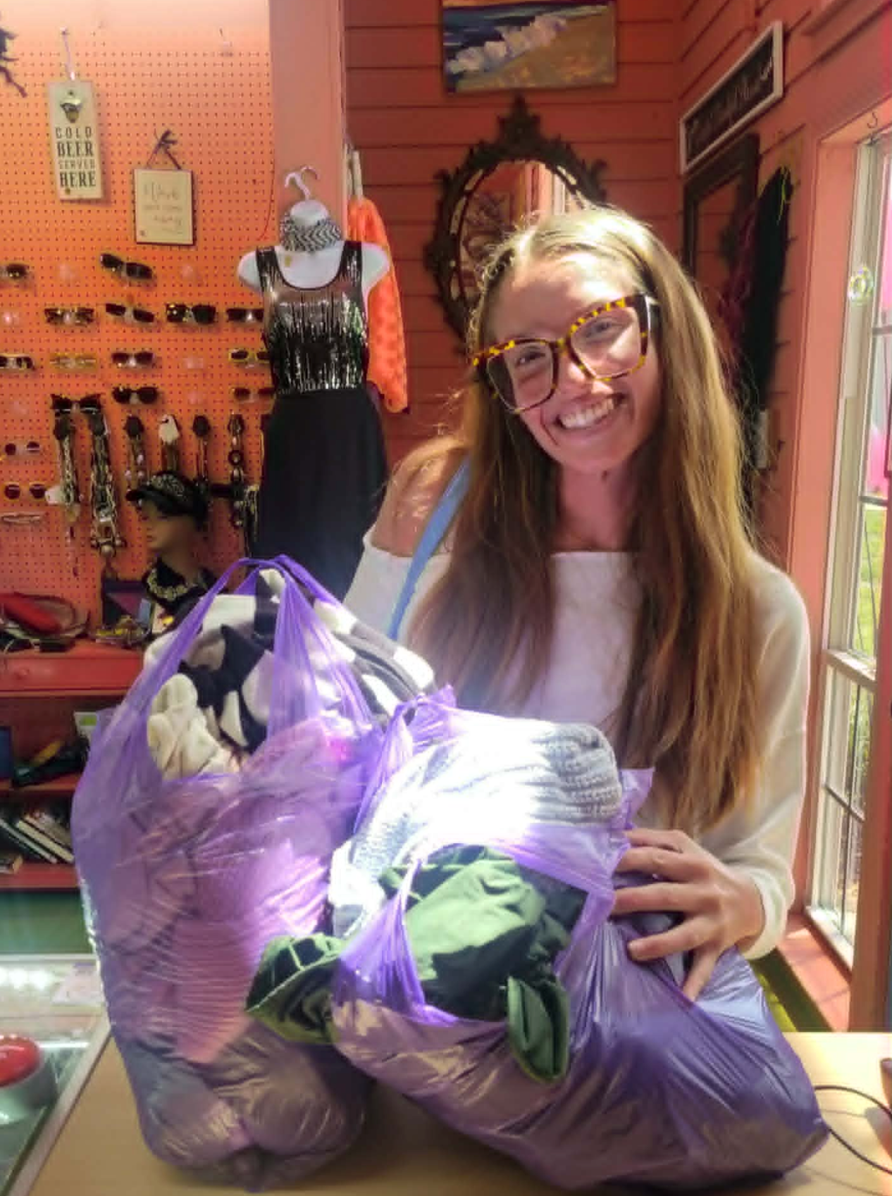 Group of happy shoppers with their $20 bag sale finds